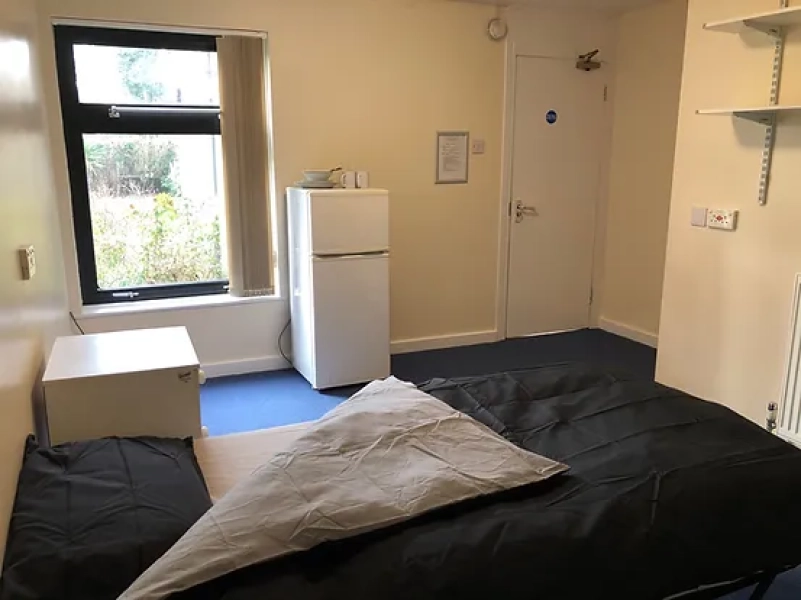 Individual well decorated and carpeted bed sitting rooms with single bed, bedside cabinet, storage for clothes and a fridge freezer. Bed linen and crockery supplied. Wifi and TV points in all rooms.  ​  Lockable cupboard for food in small kitchens.